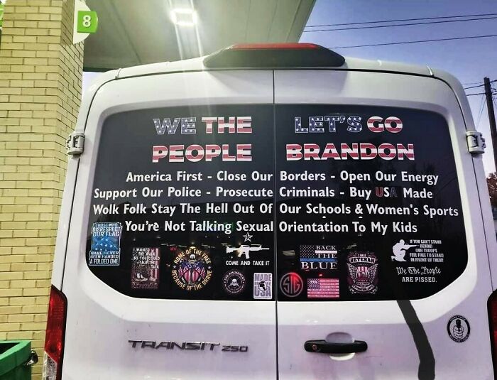 Van with various political messages and stickers, highlighting sign fails due to contradictory slogans and statements.