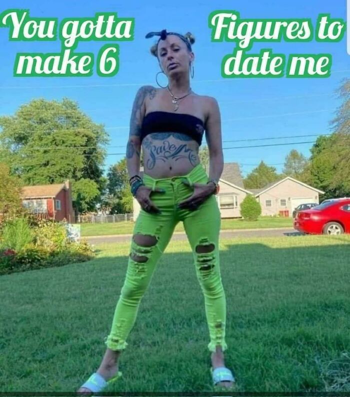 Person in neon green pants with tattoo, standing in a yard with a humorous sign fail in the background.