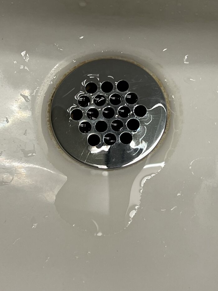 At A Hockey Rink And The Sink Had Drain Holes Shaped Like Hockey Pucks