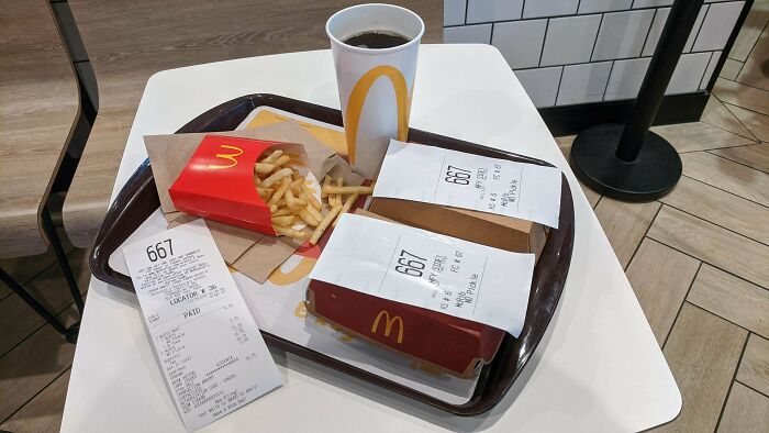 McDonald's meal tray with two identical order numbers, fries, and a drink illustrating a wild coincidence captured in a photo.