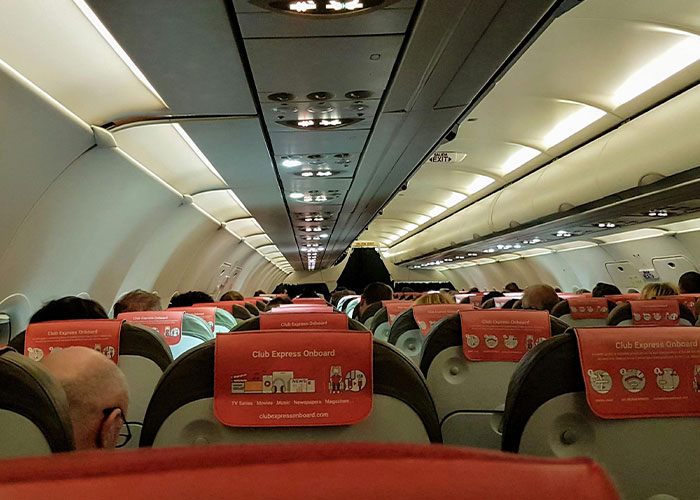 Woman’s Flying Faux Pas Sparks Heated Debate About Flight Etiquette
