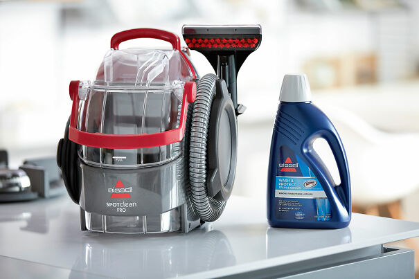 The-BISSELL-SpotClean-Pro-machine-with-a-bottle-of-detergent-661775ea0322e.jpg
