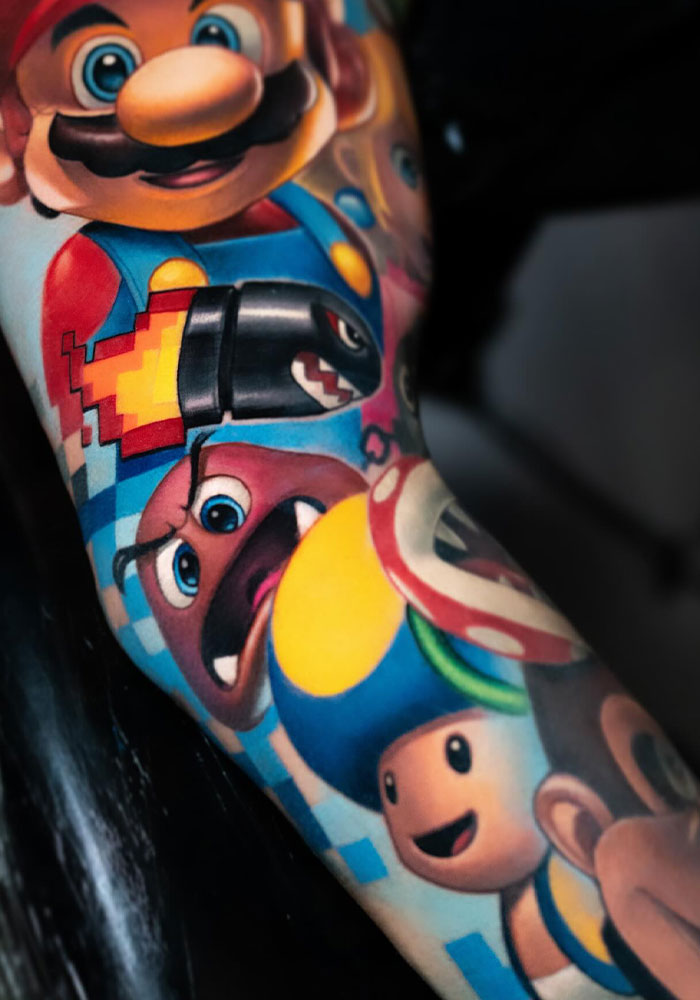 “Practice How To Live With One Arm,” Fans Tell Customer After His Mario Tattoo Goes Viral