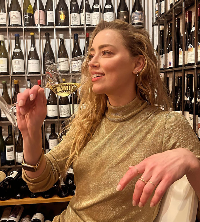 Amber Heard Poses With Champagne Glass In Rare Photo Following Move And Name Change