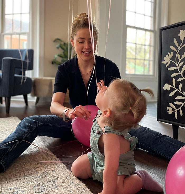 Amber Heard Poses With Champagne Glass In Rare Photo Following Move And Name Change