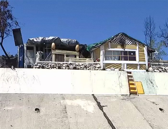 Homeless Man Builds Entire Makeshift House With Lights And Stove Next To LA Freeway