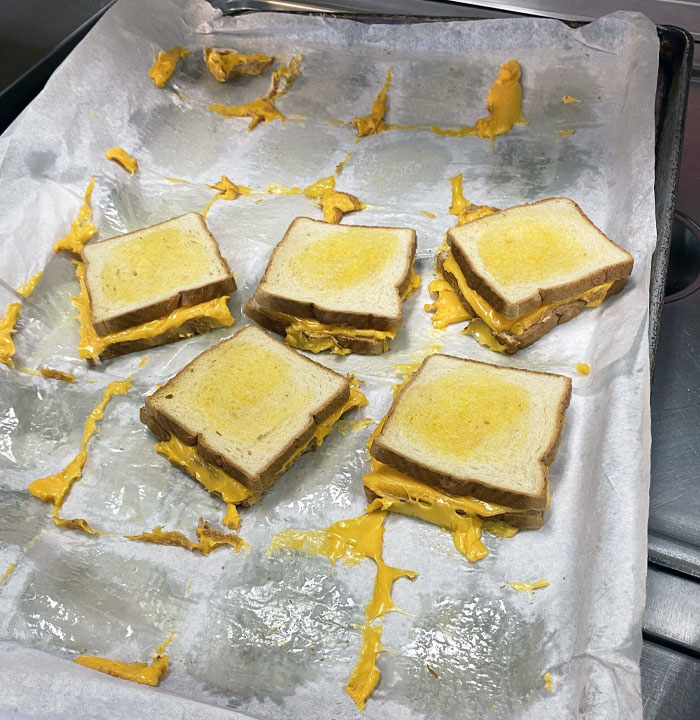 These "Grilled" Cheese Sandwiches I’m Serving To The School Kids At Work. The Cheese Is Sticking To The Tray Like Glue. Lunch Starts At $3.75, USA