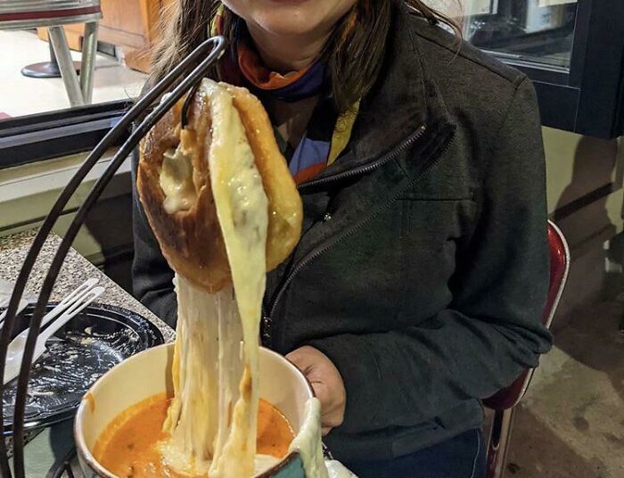 Yes That Is A Bagel Filled With Cheese Mounted Like A Deer Over A Bowel Of Tomato Soup