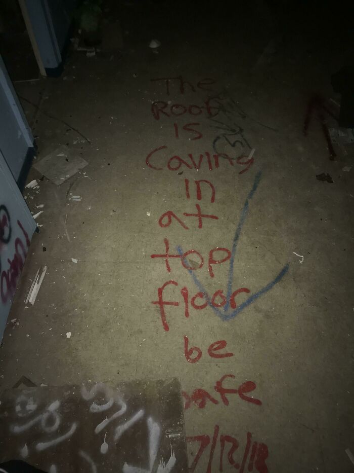 A Warning At The Entrance To An Abandoned Asylum