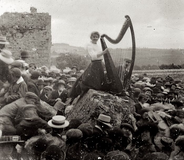 A Young Woman Playing A Harp To A Large Crowd, Rock Of Cashel, Ireland, Ca. 1910 - Photographer Unknown