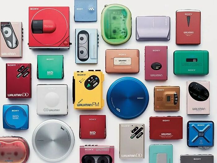 Various colorful Sony Walkman models from the nineties, showcasing nostalgic tech design from that decade.