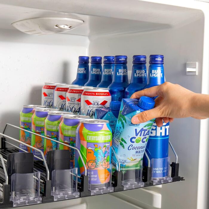 A self-Pushing Soda Can Dispenser Turns Your Fridge Into A Vending Machine