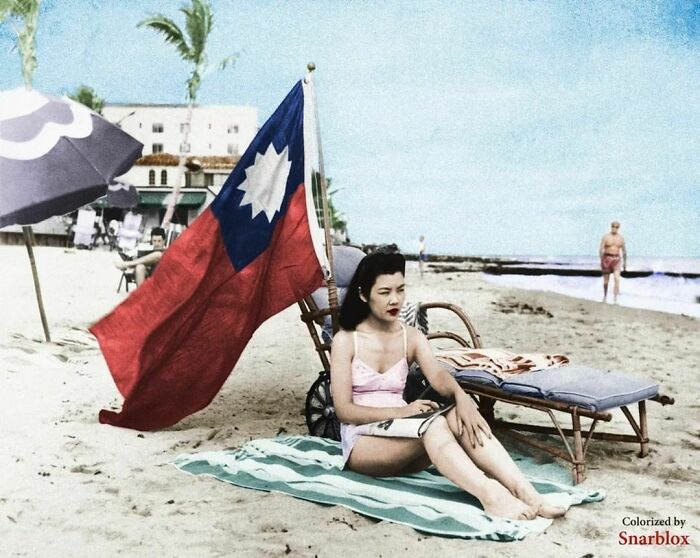 Ruth Lee, A Hostess At A Chinese Restaurant, Flies A Chinese Flag So She Isn’t Mistaken For Japanese When She Sunbathes On Her Days Off In Miami. Dec. 15, 1941. Color By Snarlbox