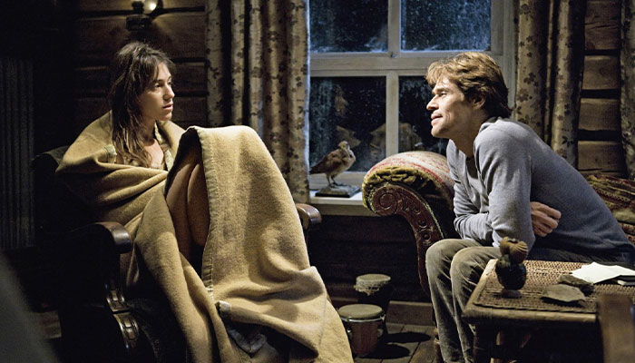 Two movie stars wrapped in a blanket, sitting across from each other in a cozy room, sharing an intense moment. Two movie stars wrapped in a blanket, sitting across from each other in a cozy room, sharing an intense moment.