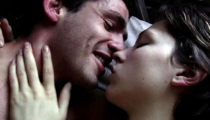 Two actors in an intimate movie scene, closely embracing and facing each other, depicting love and passion. Two actors in an intimate movie scene, closely embracing and facing each other, depicting love and passion.