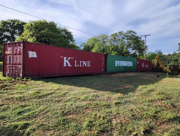 Folks Praise Woman Who Made A Whole Fence Of Shipping Containers To Ruin Entitled Neighbors’ View