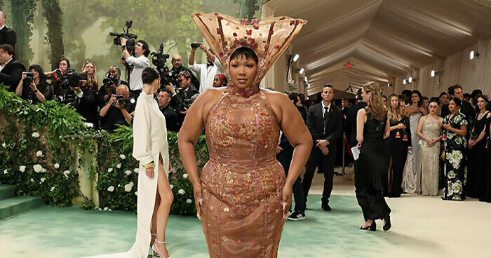 Lizzo Calls Critics “Fatphobic” As Her Met Gala Outfit Is Compared To Lampshades And Menstrual Cups