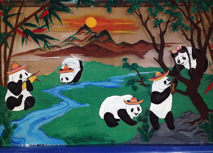 A Local Mexican Restaurant Used To Be A Chinese Restaurant. Instead Of Painting Over A Mural, They Just Put Sombreros On The Pandas 