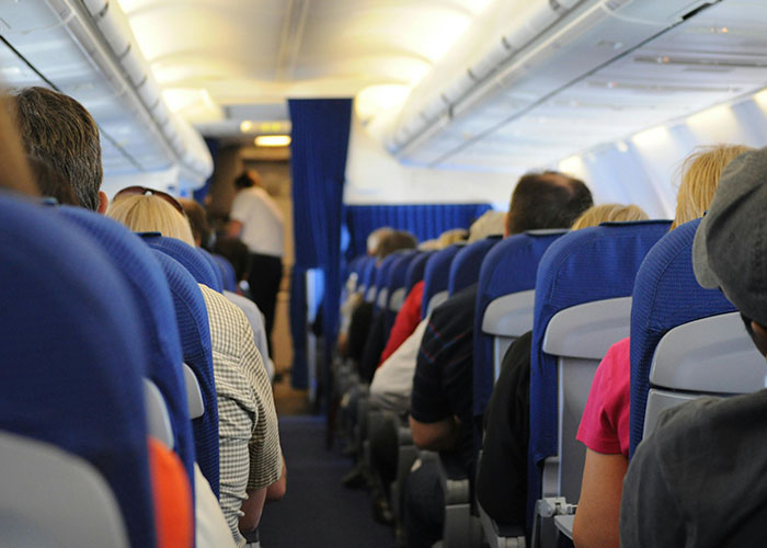 Passengers Unite Against Woman Who Wouldn't Give Up Her Aisle Seat For Family Of Five