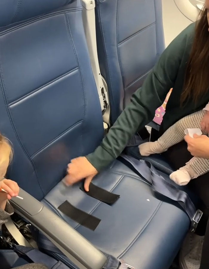 Mom Sparks Outrage After She Sticks Baby To Plane Seat With Velcro As “Parenting Hack”