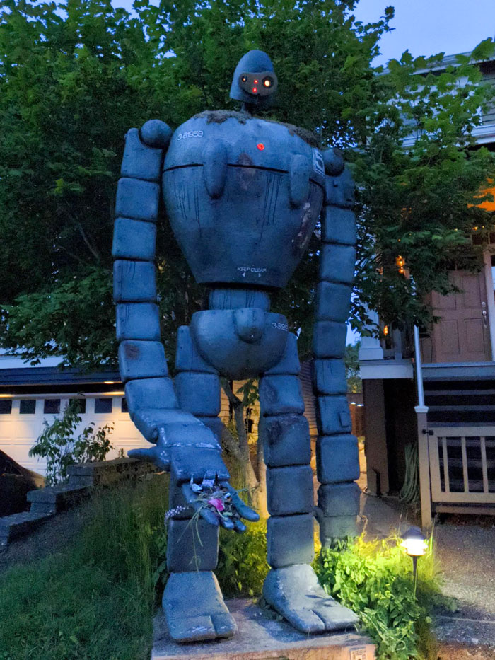 My Neighbors Have A 12 Ft Tall Robot With A Hand Full Of Flowers