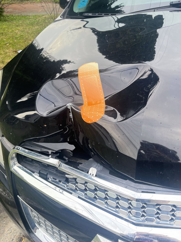 My Neighbor Got A Giant Bandage To "Fix" A Dent On Their Car