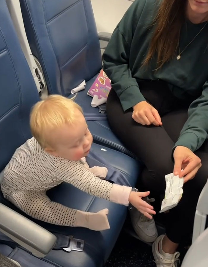 Mom Sparks Outrage After She Sticks Baby To Plane Seat With Velcro As “Parenting Hack”