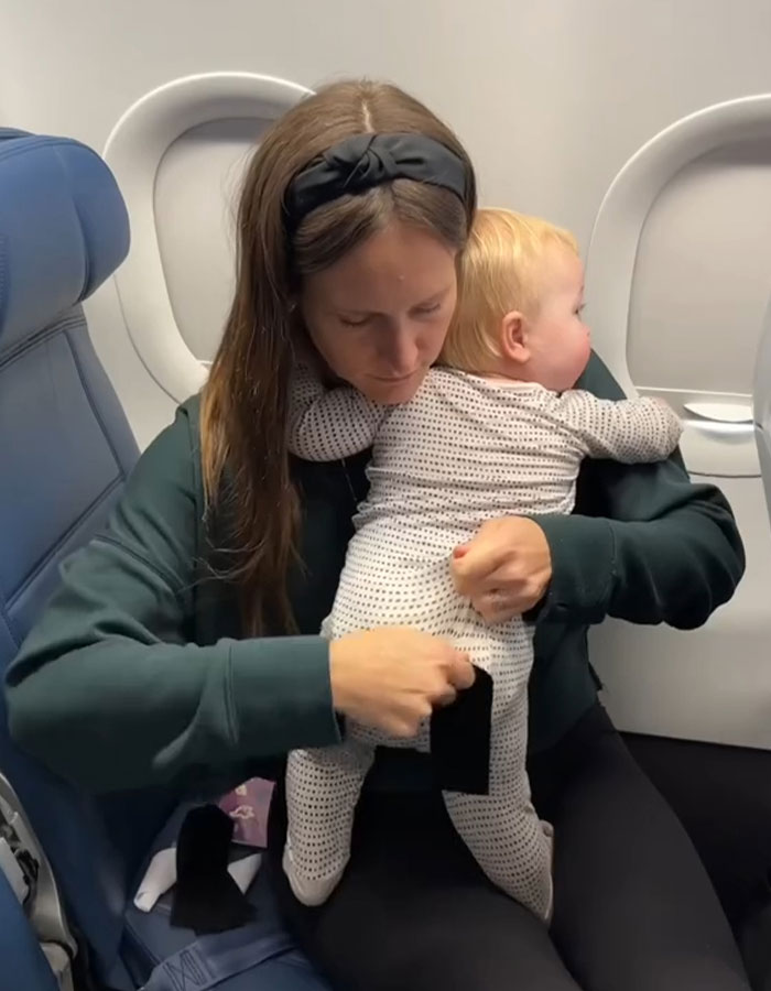 Mom Sparks Outrage After She Sticks Baby To Plane Seat With Velcro As “Parenting Hack”