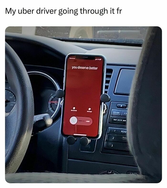 Interior of a car showing a phone on the dashboard with a message, reflecting relatable moments for students and young adults.