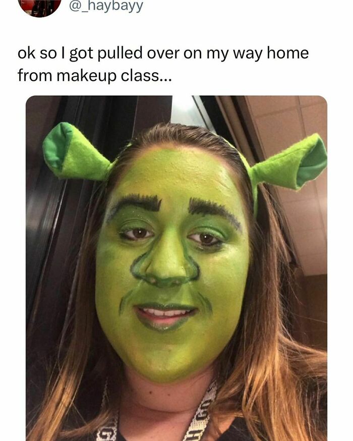 Student with green face paint and Shrek ears after makeup class, illustrating relatable moments in students and young adults' lives.