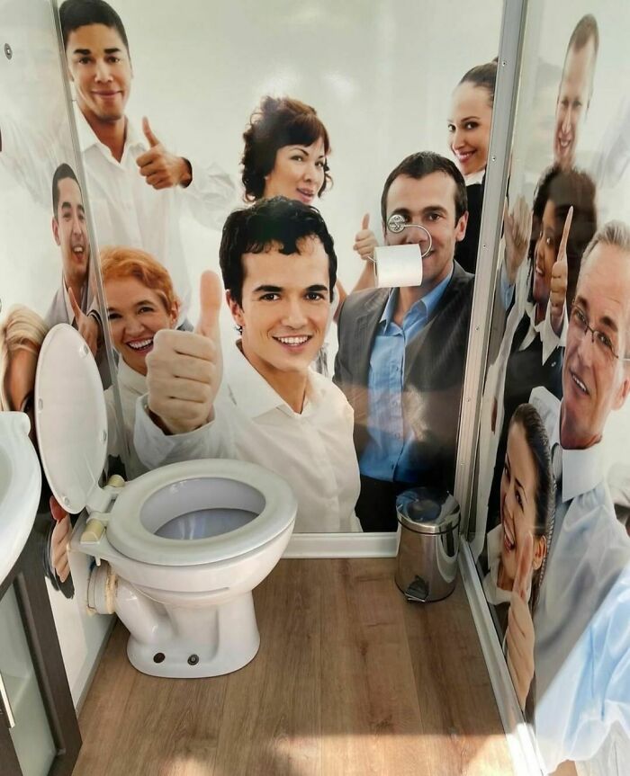 Bathroom decorated with random and cringe photos of people giving thumbs up around a toilet for unique humor fans.