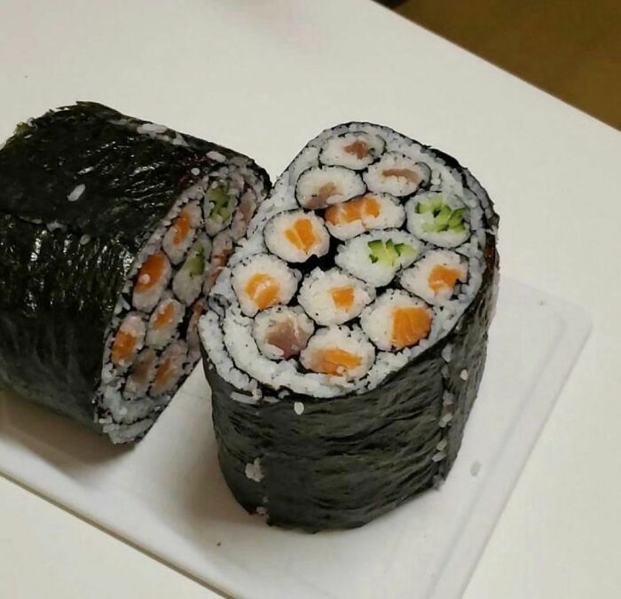 Sushi roll featuring multiple smaller sushi pieces inside, a random and cringe photo for unique sense of humor fans.