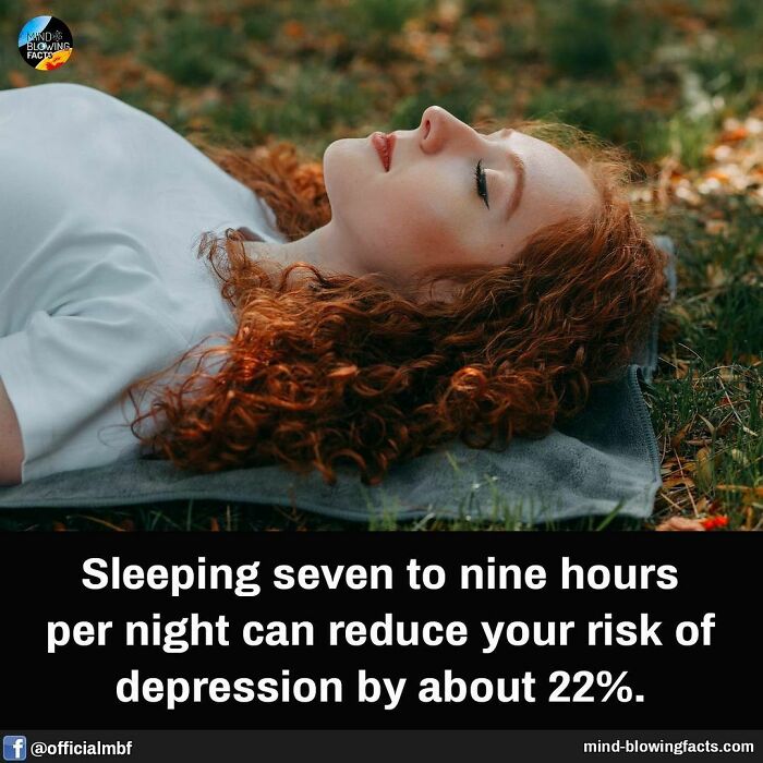 Young woman with red curly hair lying on grass, illustrating mind-blowing facts about sleep reducing depression risk.