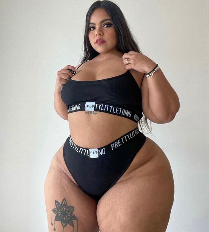 Gracie Bon in black outfit showcasing body transformation with noticeable tattoo on thigh. Gracie Bon in black outfit showcasing body transformation with noticeable tattoo on thigh.