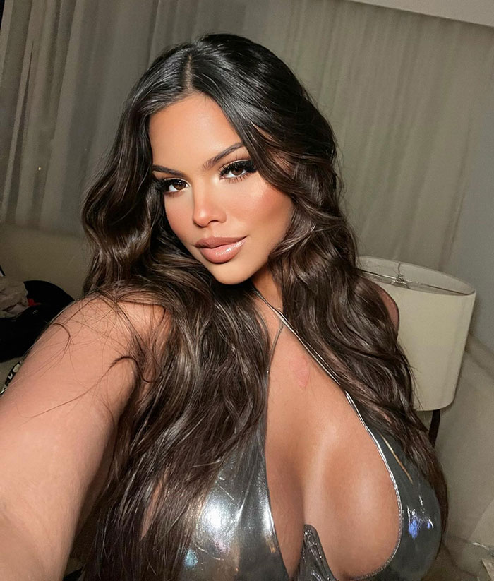 Gracie Bon in a silver outfit showing body transformation. Gracie Bon in a silver outfit showing body transformation.