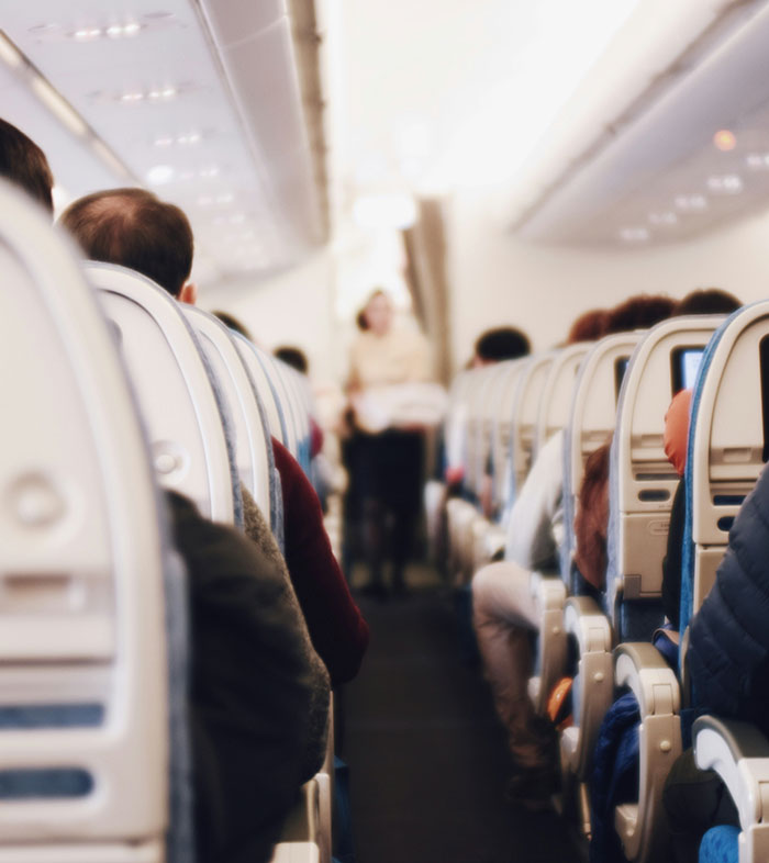 Woman Baffled To See Flight Attendant Is Her Boyfriend After He Got Up To Use The Restroom Woman Baffled To See Flight Attendant Is Her Boyfriend After He Got Up To Use The Restroom