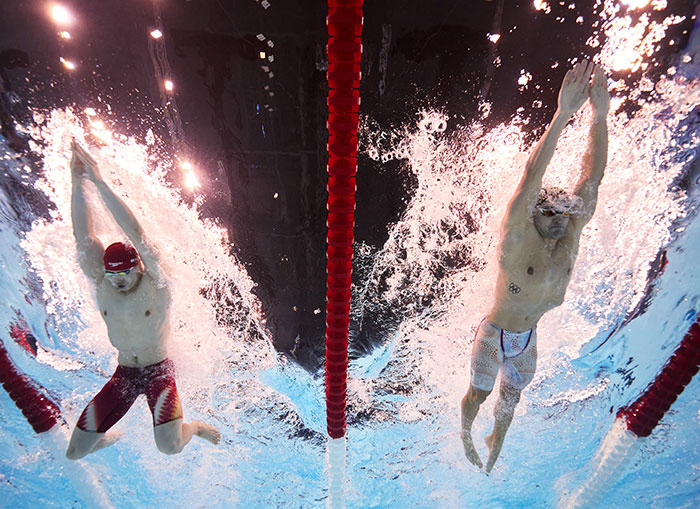 Dutch swimmer in revealing trunks during freestyle race at the 2024 Olympics. Dutch swimmer in revealing trunks during freestyle race at the 2024 Olympics.