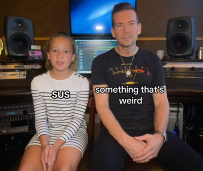 Dad and daughter discussing slang in a recording studio for Gen Alpha communication. Dad and daughter discussing slang in a recording studio for Gen Alpha communication.