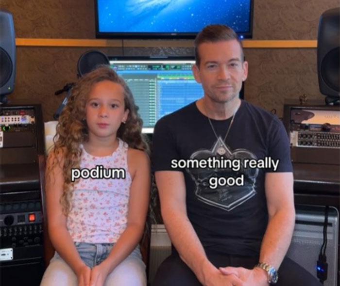 Dad learning slang from daughter in a recording studio. Dad learning slang from daughter in a recording studio.