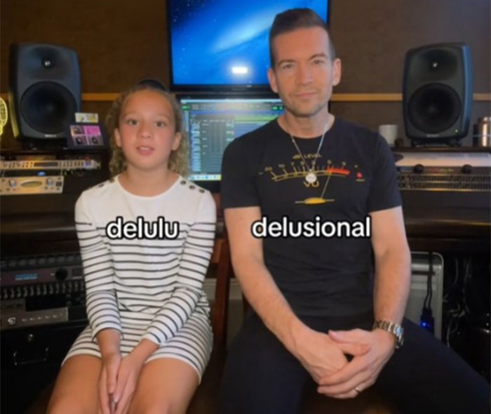 Dad learns Gen Alpha slang from daughter; text "delulu" and "delusional" displayed. Dad learns Gen Alpha slang from daughter; text "delulu" and "delusional" displayed.