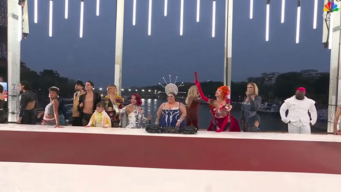 Activist Faces Backlash Over Misinterpreted “Last Supper” Act At Olympics, Files Suit Activist Faces Backlash Over Misinterpreted “Last Supper” Act At Olympics, Files Suit