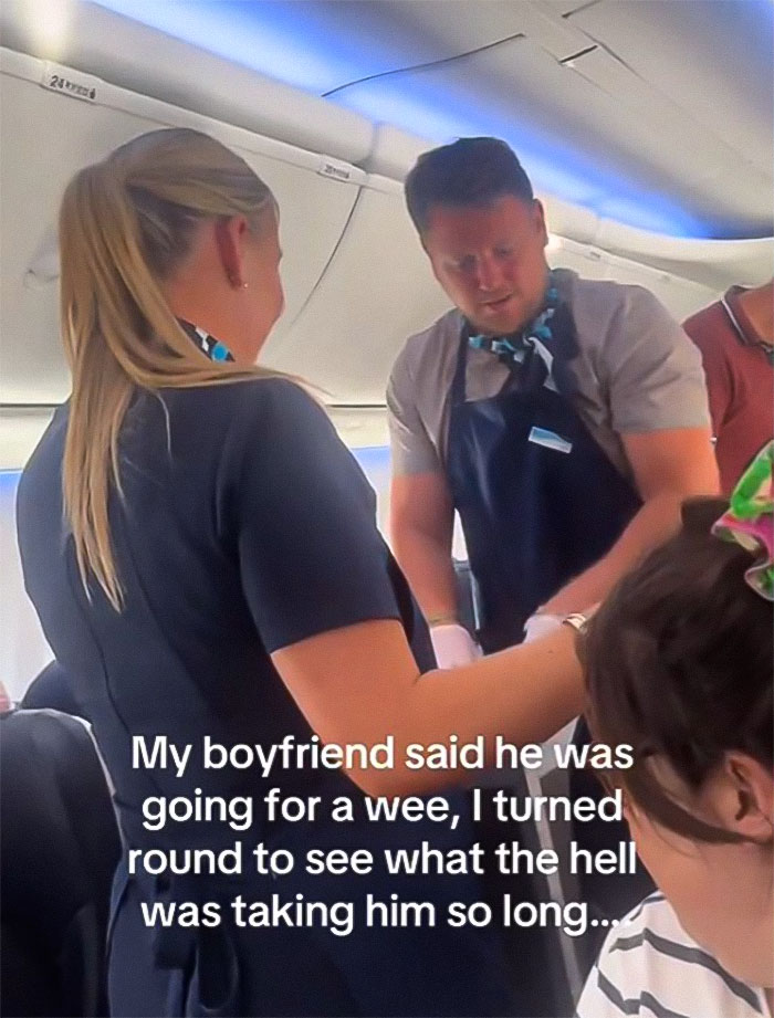 Woman Baffled To See Flight Attendant Is Her Boyfriend After He Got Up To Use The Restroom Woman Baffled To See Flight Attendant Is Her Boyfriend After He Got Up To Use The Restroom