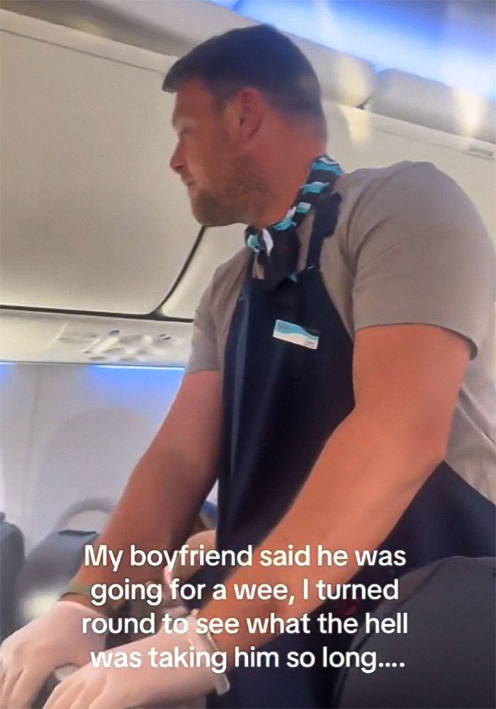 Woman Baffled To See Flight Attendant Is Her Boyfriend After He Got Up To Use The Restroom Woman Baffled To See Flight Attendant Is Her Boyfriend After He Got Up To Use The Restroom