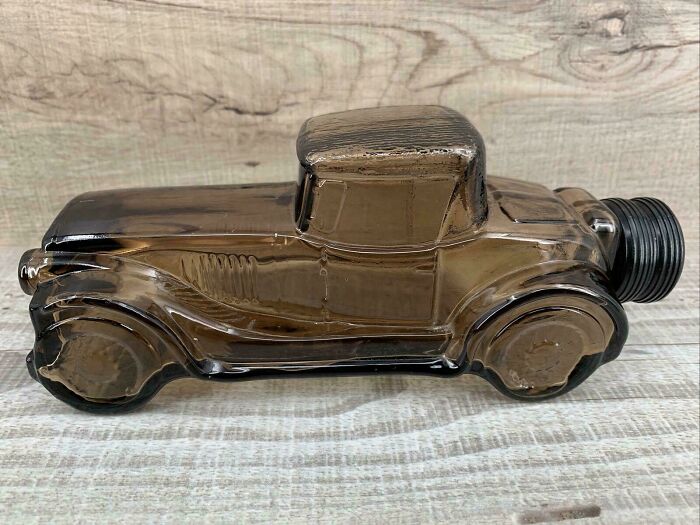 Vintage glass car bottle collectible, a nostalgic item that may remind you of your creaking joints.