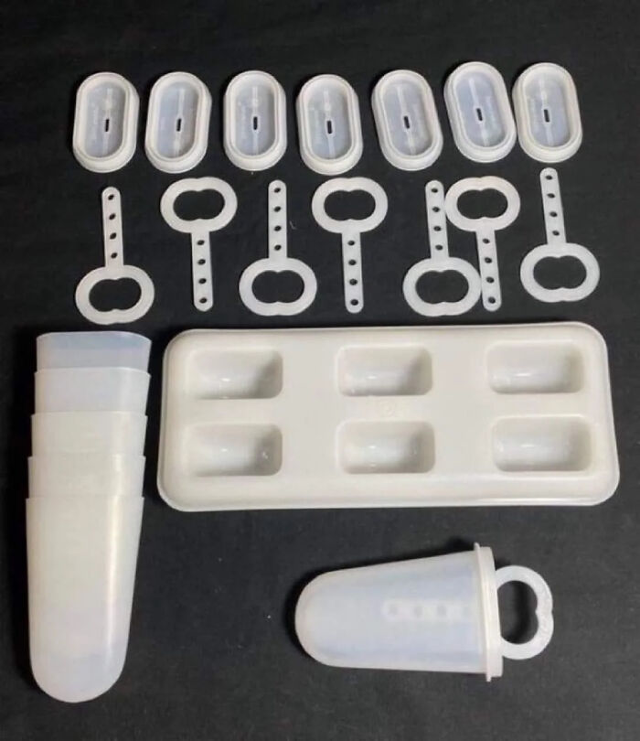 Vintage plastic ice pop molds with lids and handles, a nostalgic item that may remind you of creaking joints.