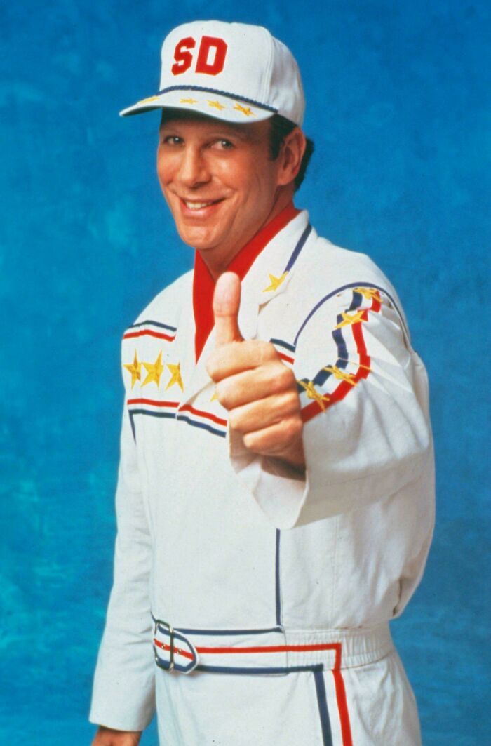 Man in vintage jumpsuit and cap giving thumbs up, a nostalgic item that may remind you of creaking joints.