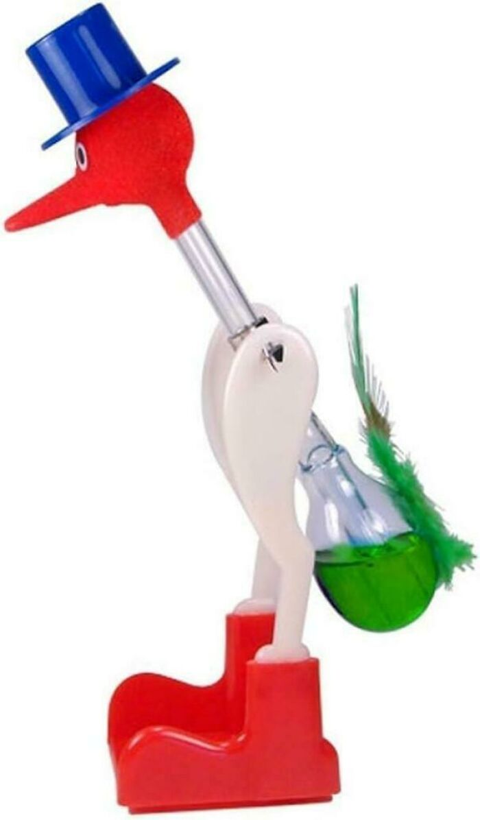 Vintage drinking bird toy with red boots and blue hat, a nostalgic item for those with creaking joints memories