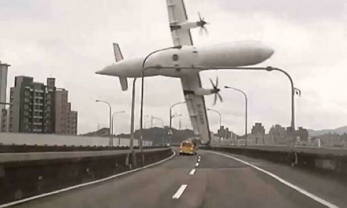 Airplane crashing near road overpass, a terrifying moment that triggers fear in anyone with megalophobia.