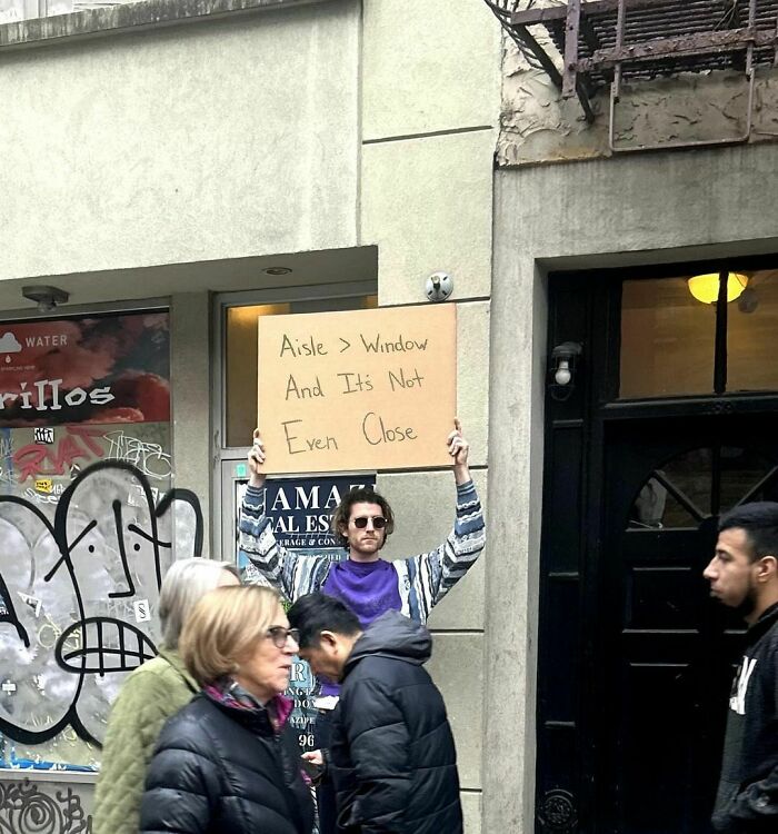 Clever-Dude-With-Sign-Annoying-Things-Protesting