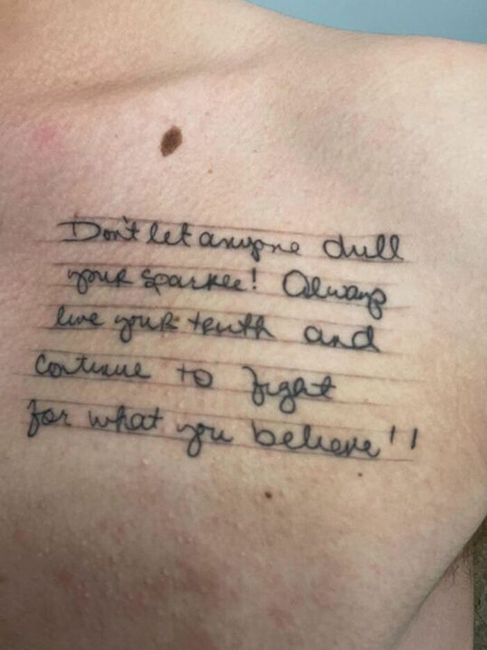 Tattoo of a heartfelt message on a student's chest, reflecting a teacher's impactful words. Tattoo of a heartfelt message on a student's chest, reflecting a teacher's impactful words.